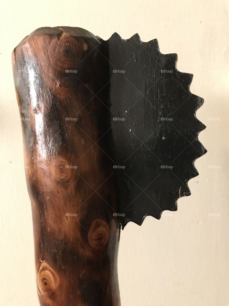 A very creative work of art with a razor saw blade as a ax head. It is both an extraordinary masterpiece and fighting weapon rolled into one.