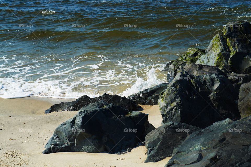 Waves hit the rocky shore