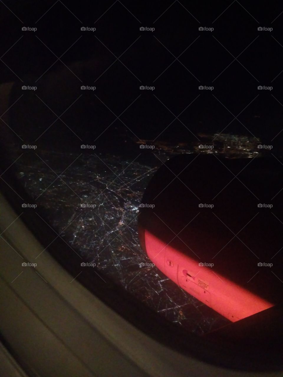 Night city from the window of the plane