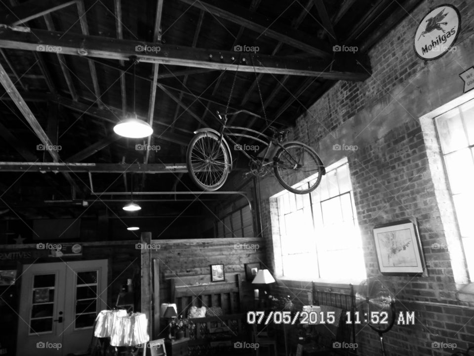 Mary Poppins last ride. This is a picture of a old 👵 bicycle 🚲 that was hanging from the ceiling in a gift shop in Graham Texas
