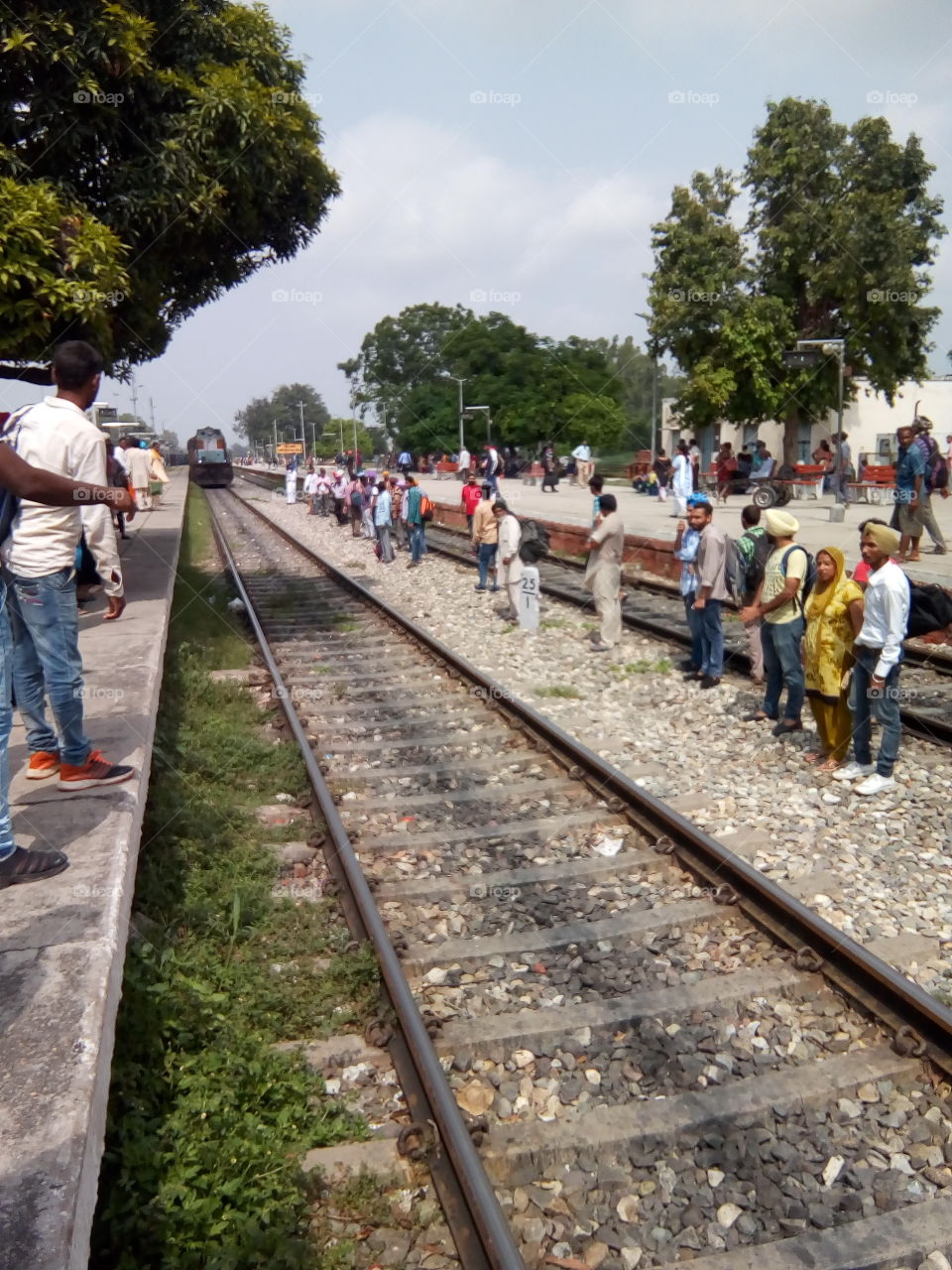 Travelers waiting for train at railway station city Patiala. India.