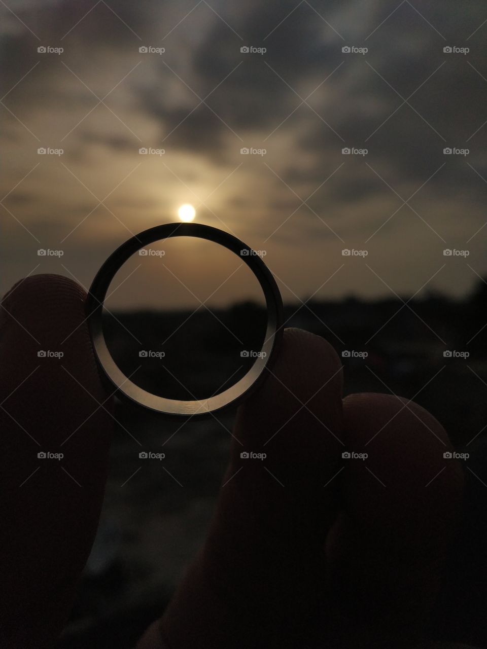 Sunset makes the stone of ring.