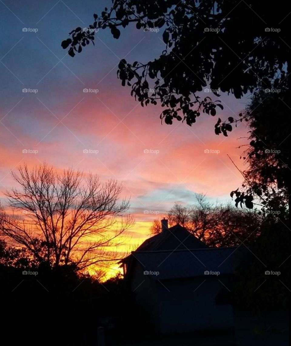 Sunrise coming up over the neighborhood
