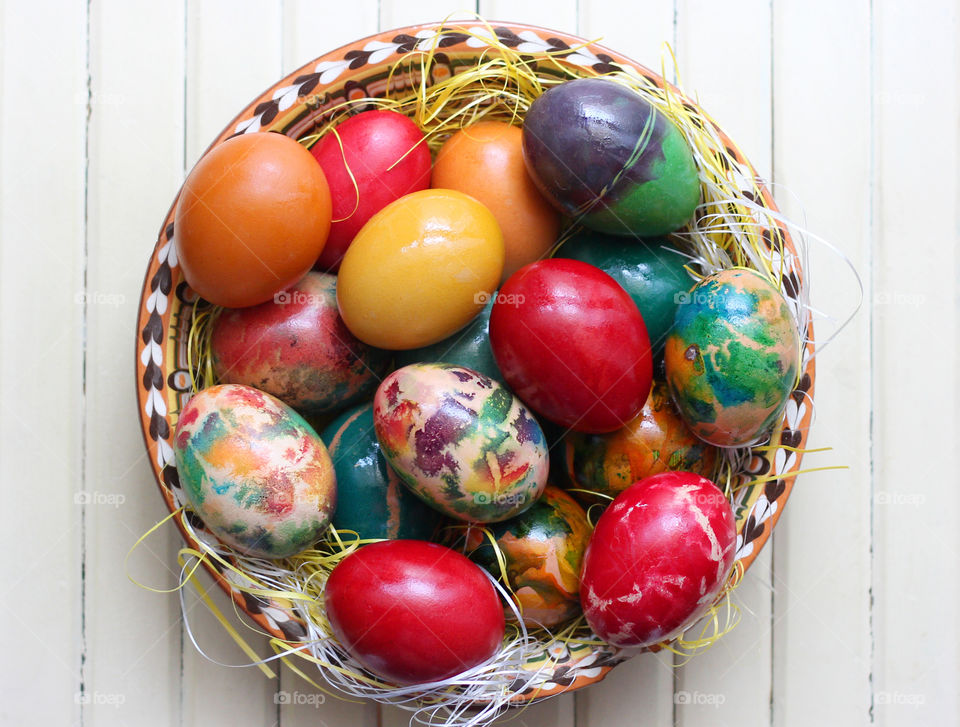 Colorful Easter eggs in a plate