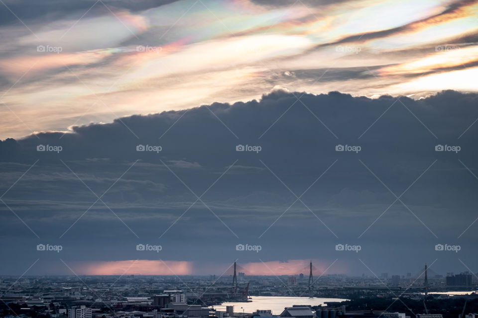 Miracle natural of colorful sky over big black cloudy before rain