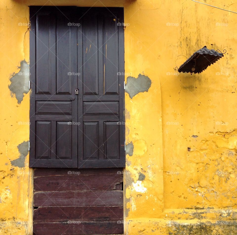 Yellow wall. Yellow wall of old quater at Hoi An old town in Vietnam