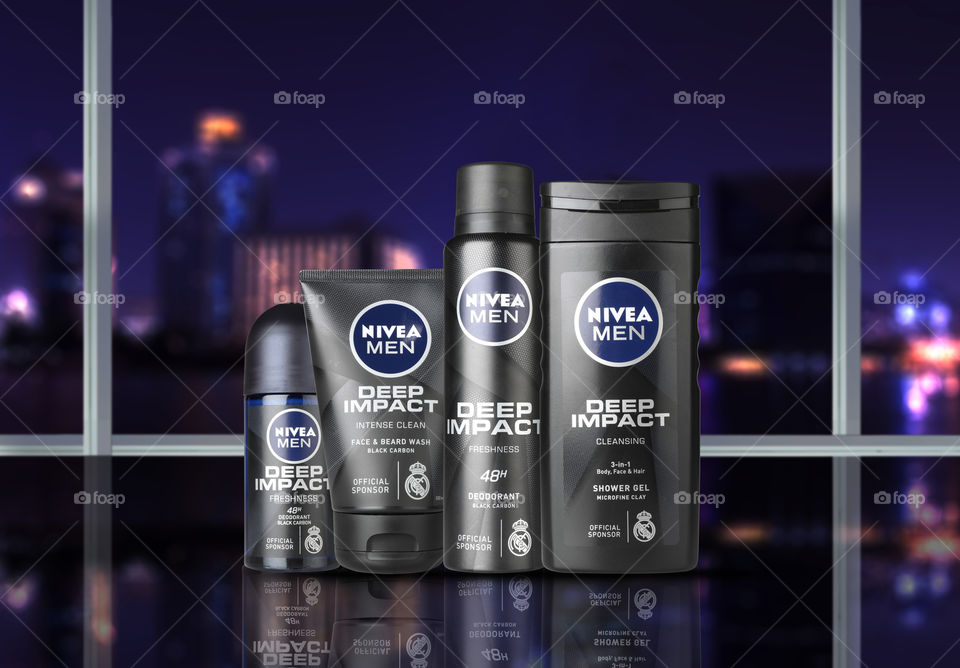 Nivea Men Deep Impact Shower Gel, Deodorant Spray, Deodorant Roll On and shower gel with city view in the background