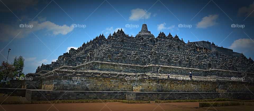 The world famous Borobudur temple outside of Yogyakarta Indonesia - photo from a distance to capture most of the massive temple