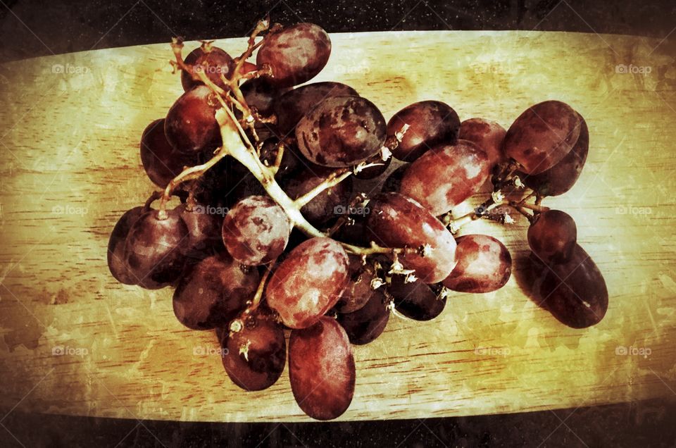 Red grapes on a wooden 