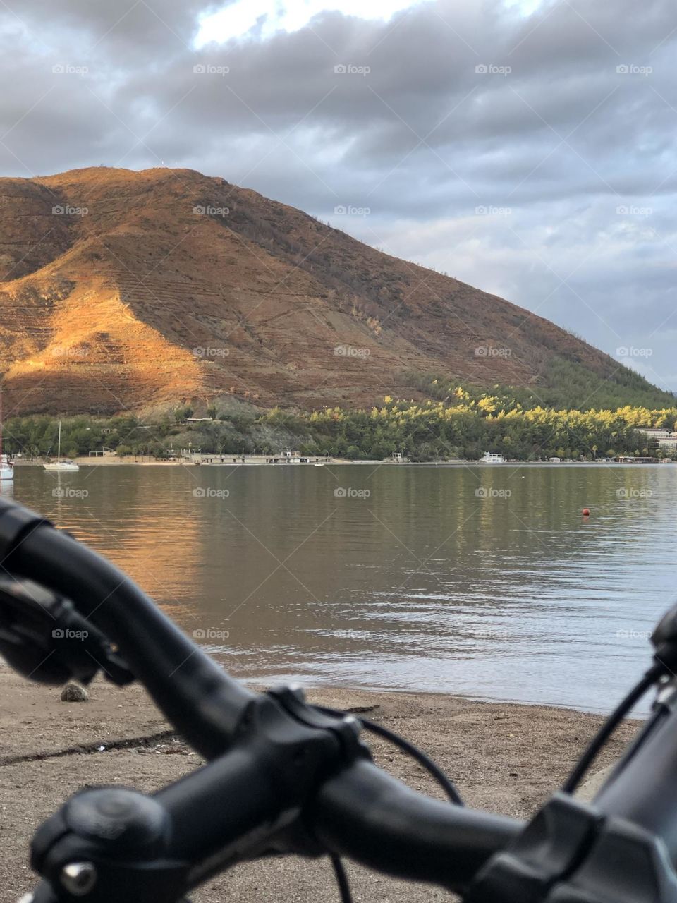 Bicycle walk on a Turkish seaside. Mountain sunset view