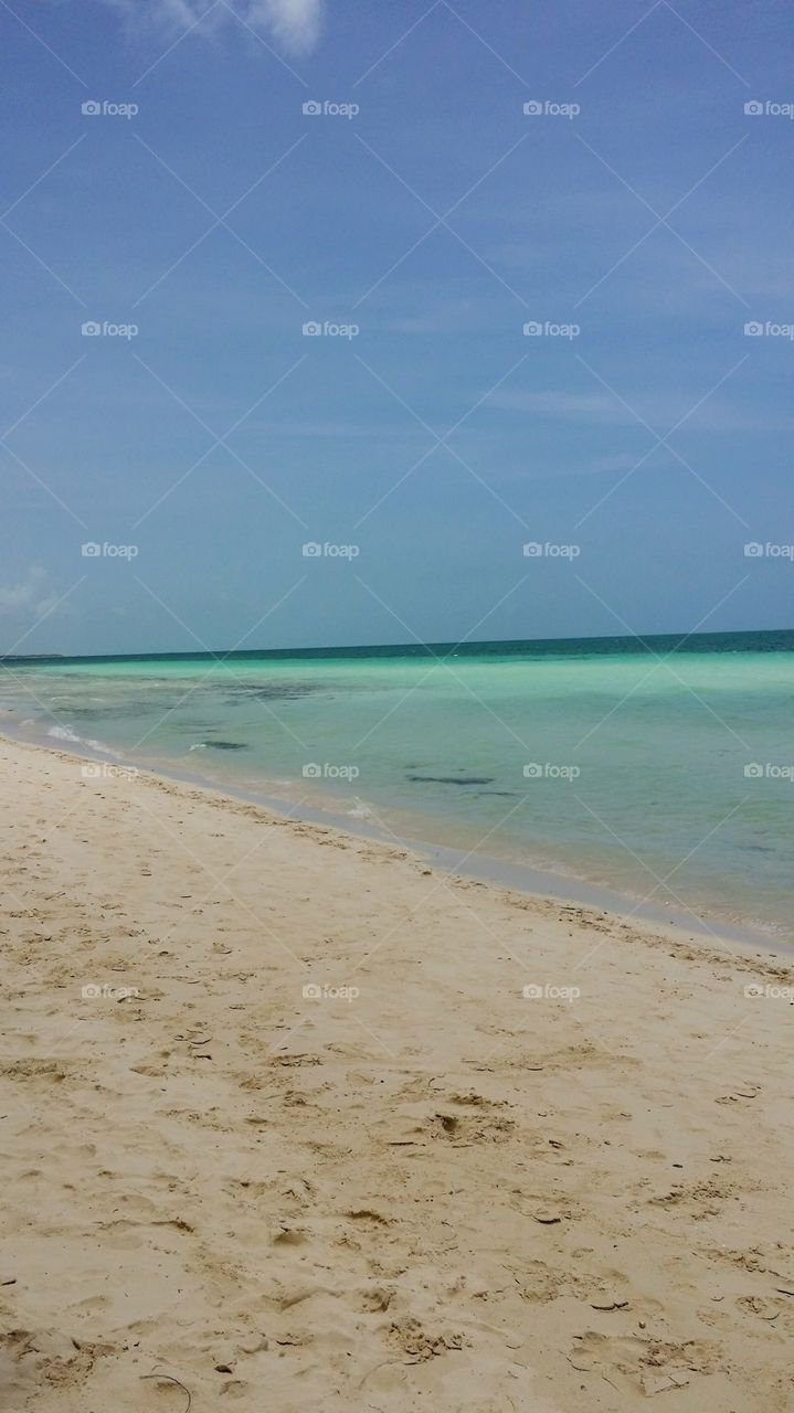 White sand beach of Cuba, turquoise sea ans blue sky