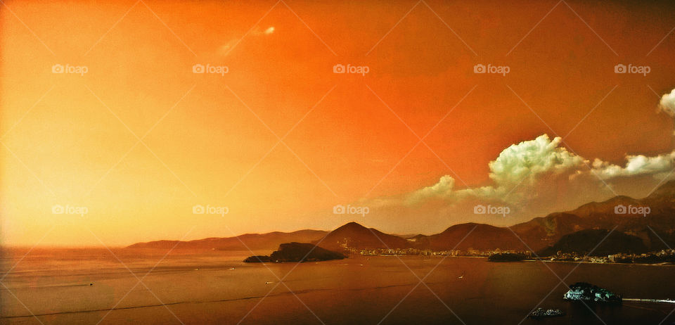 amazing sunset, sea, mountains, island and city