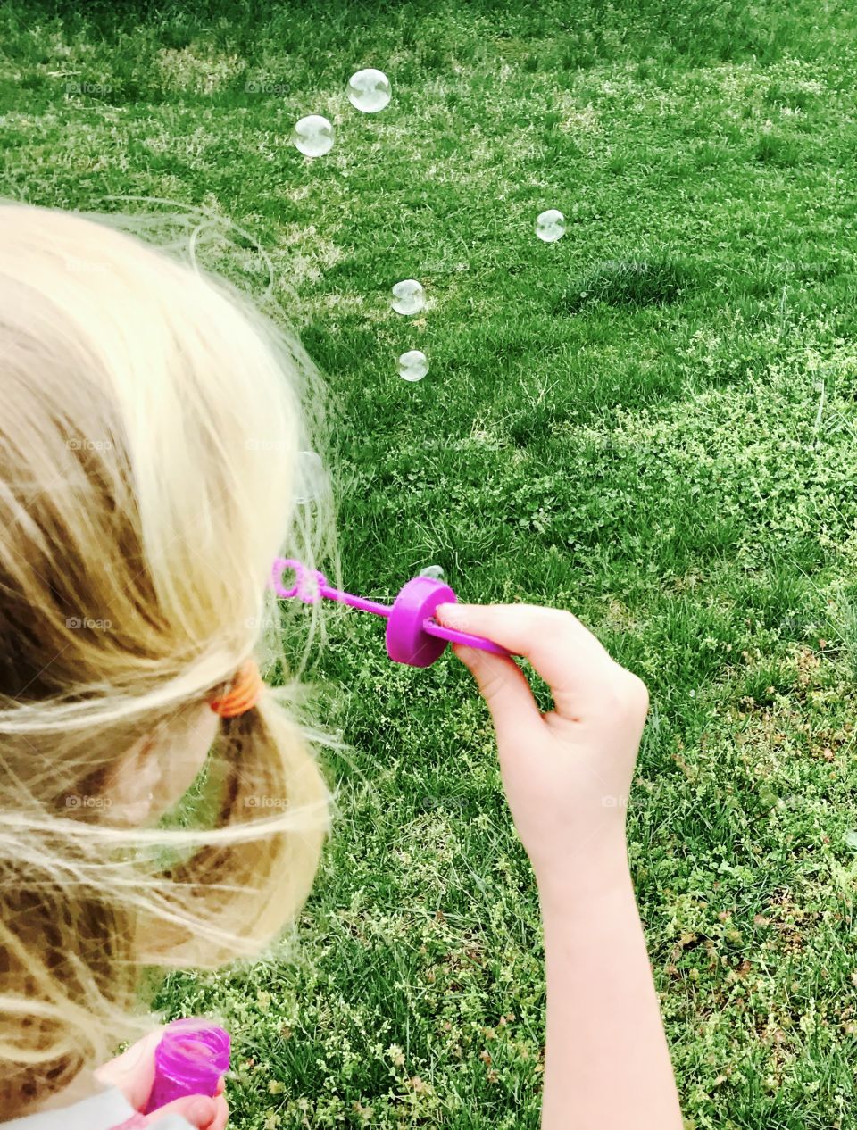 Close-Up Girl Blowing Bubbles