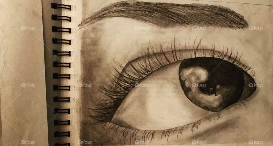 My eye drawn in graphite pencil.