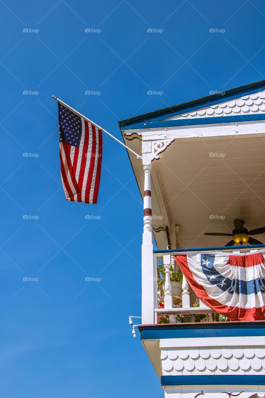 American flag flying high for July fourth celebrations in Jamestown California at the Jamestown hotel 