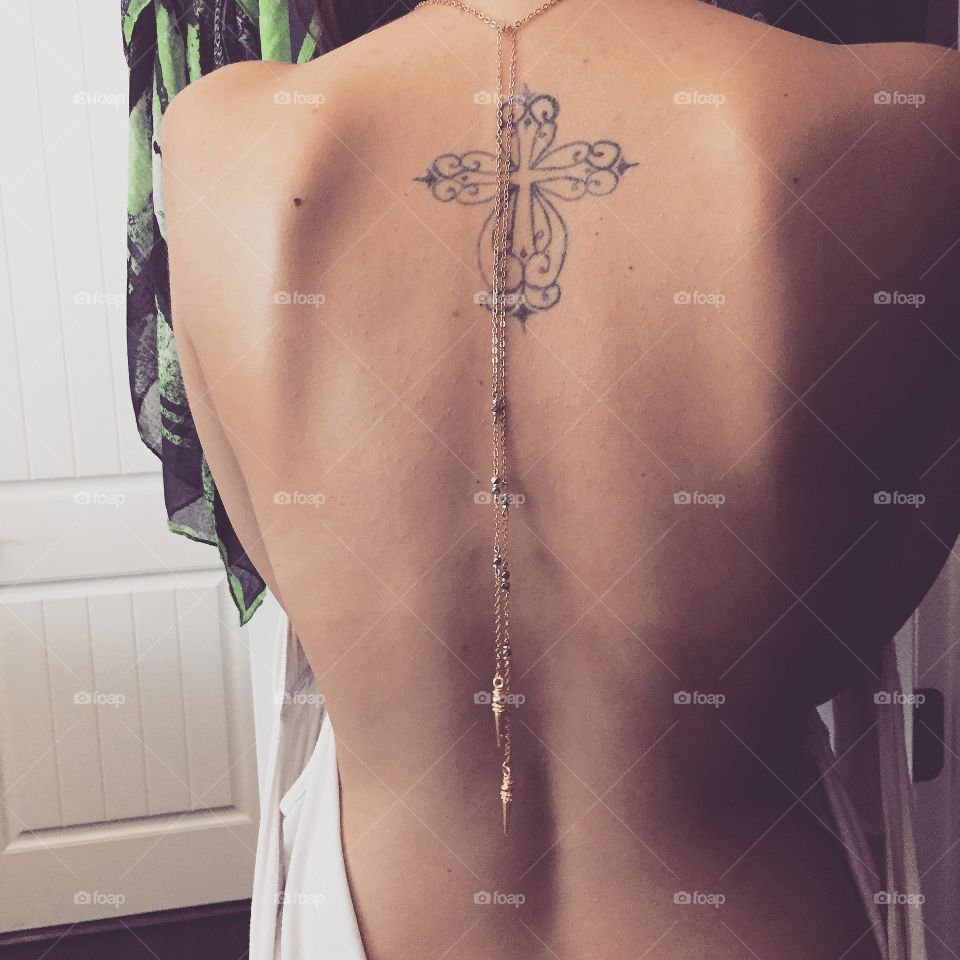 Cross my back . Behind the scenes of my jewelry designer Lookbook shoot with a model. A beautiful lariat necklace and an awesome tattoo