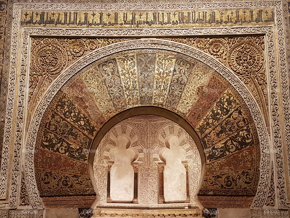 Rich ornamention of the mihrab in the mosque-cathedral in Cordoba, Spain.