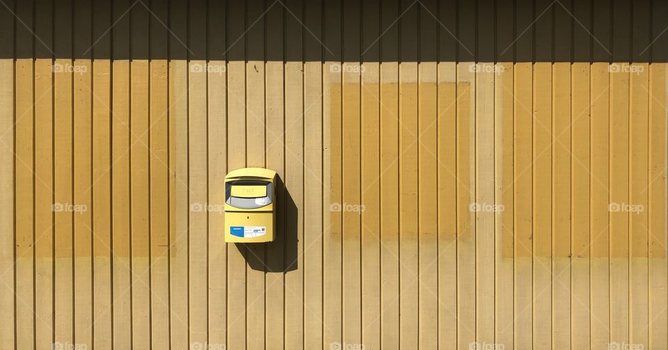 Yellow and yellow postbox