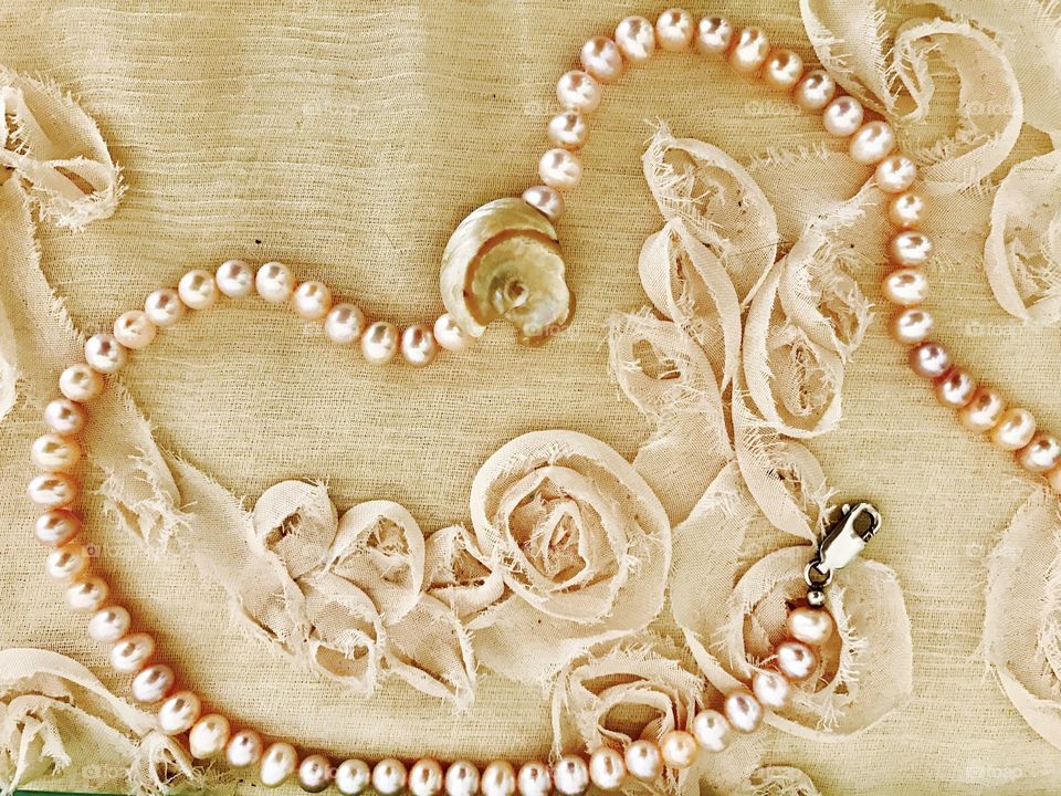 High angle of a pearl necklace
