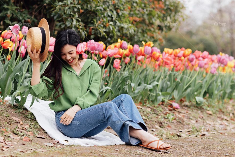 Happy Asian woman and tulips 