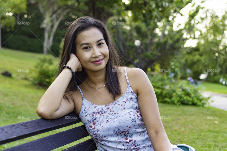 Relaxing on the bench in the park