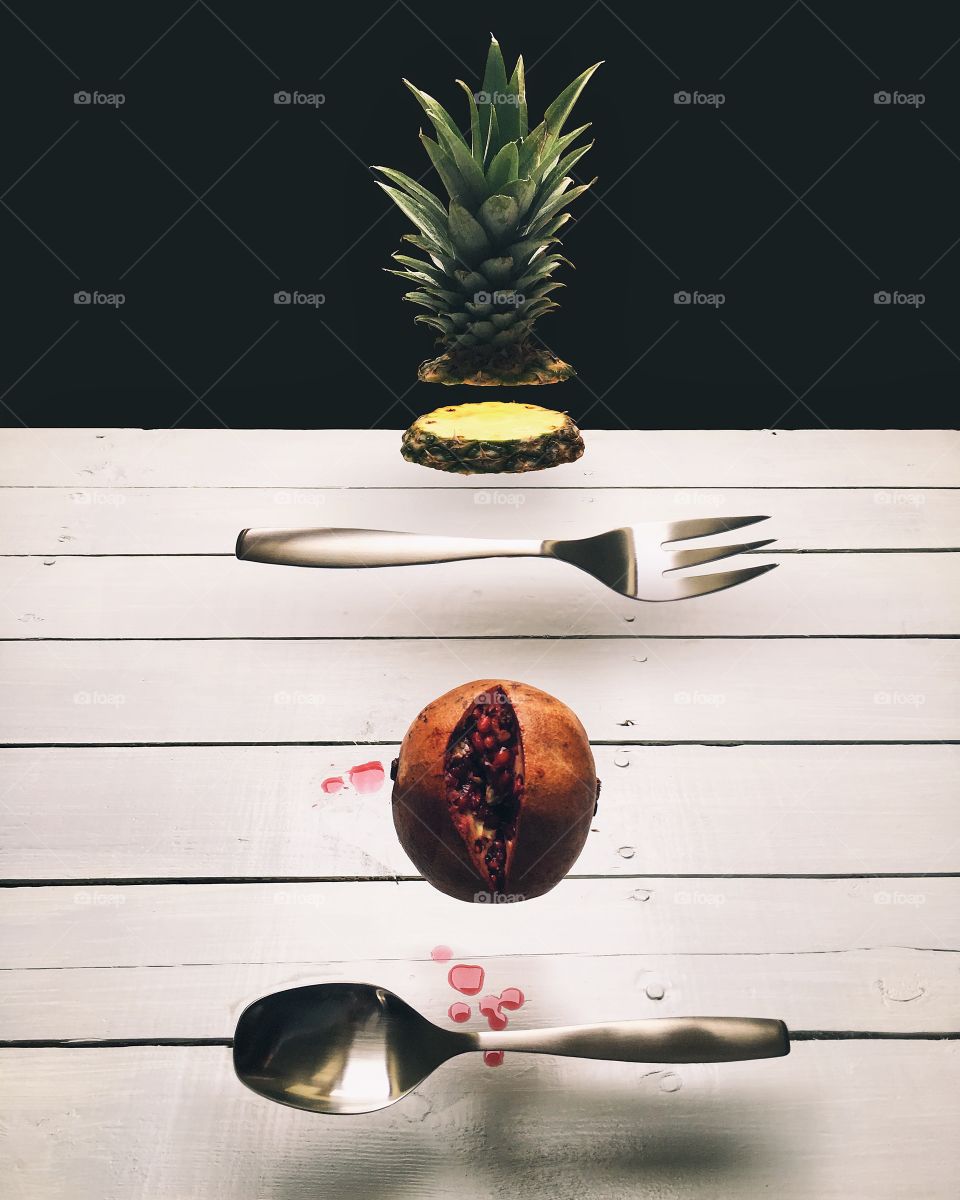 Fruits and cutlery in motion