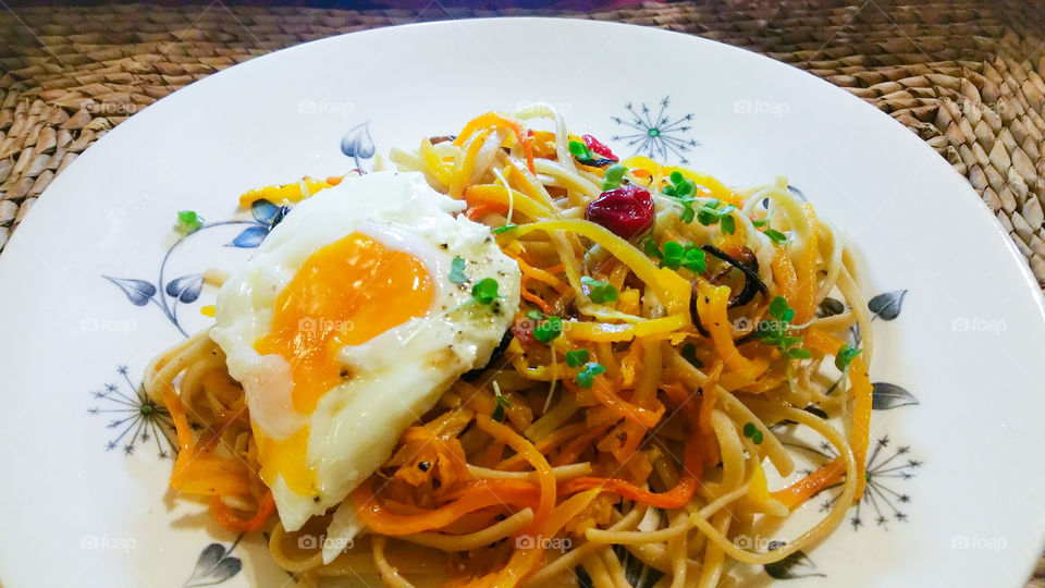 Wholewheat pasta mixed with other ingredients on plate