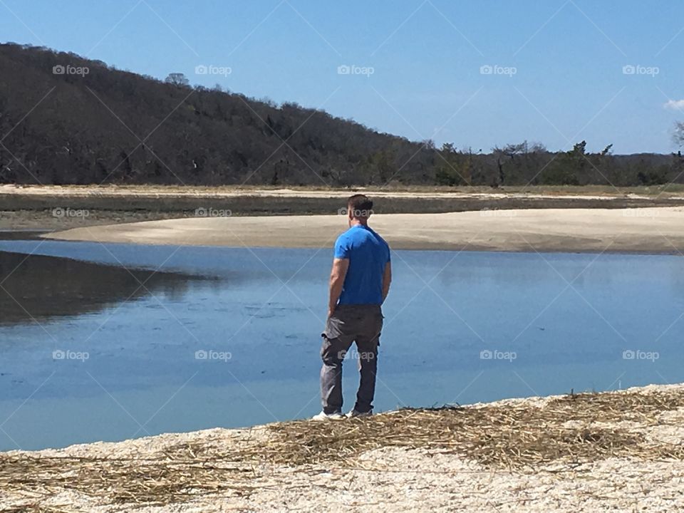 Looking at the beautiful scenery on the beach.