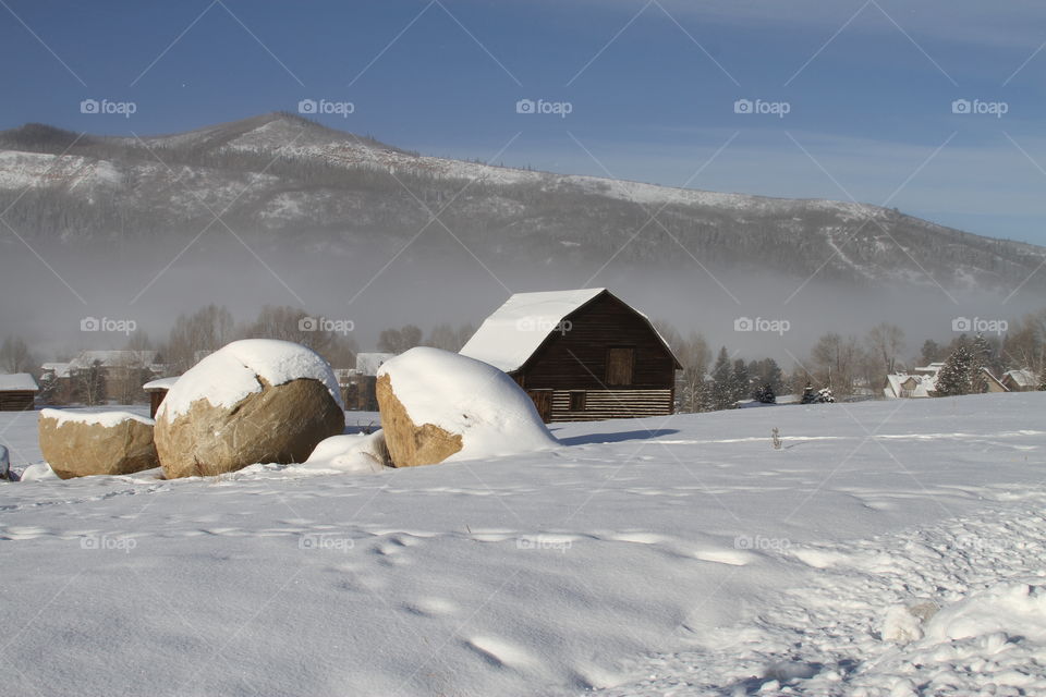 Barn in snowy mountains