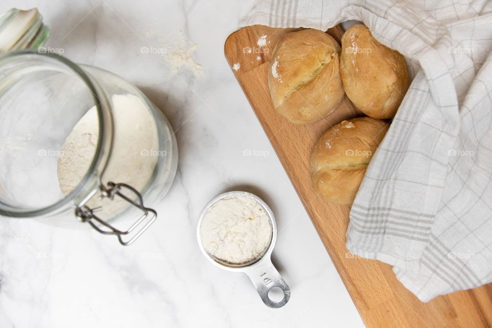 Overhead of flour and homemade bread