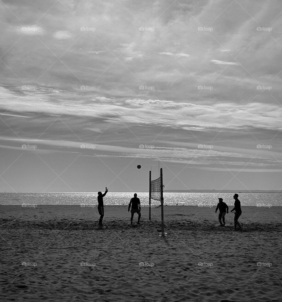 Volleyball players on a beach 