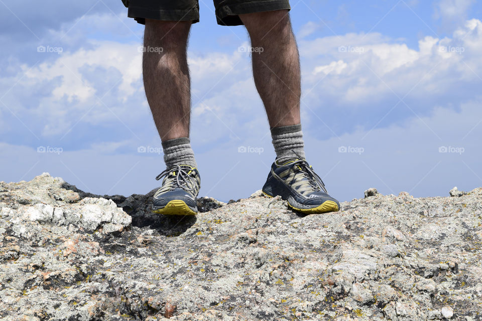 A hike then a rock scramble to reach the top of Little Devil's Tower in South Dakota. At the top, you can see for miles and feel like you are on top of the world.