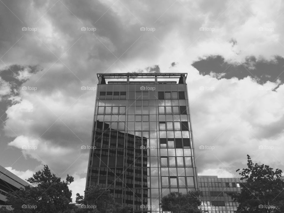 Mirror the Sky. A great, high-contrast reflection of the clouds from a glass building. 