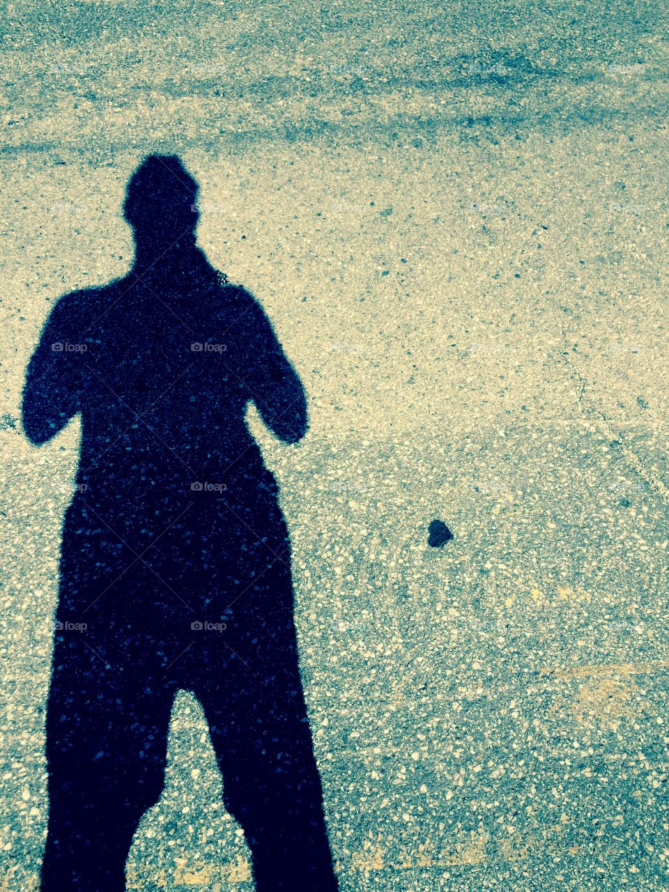 Woman's shadow on street