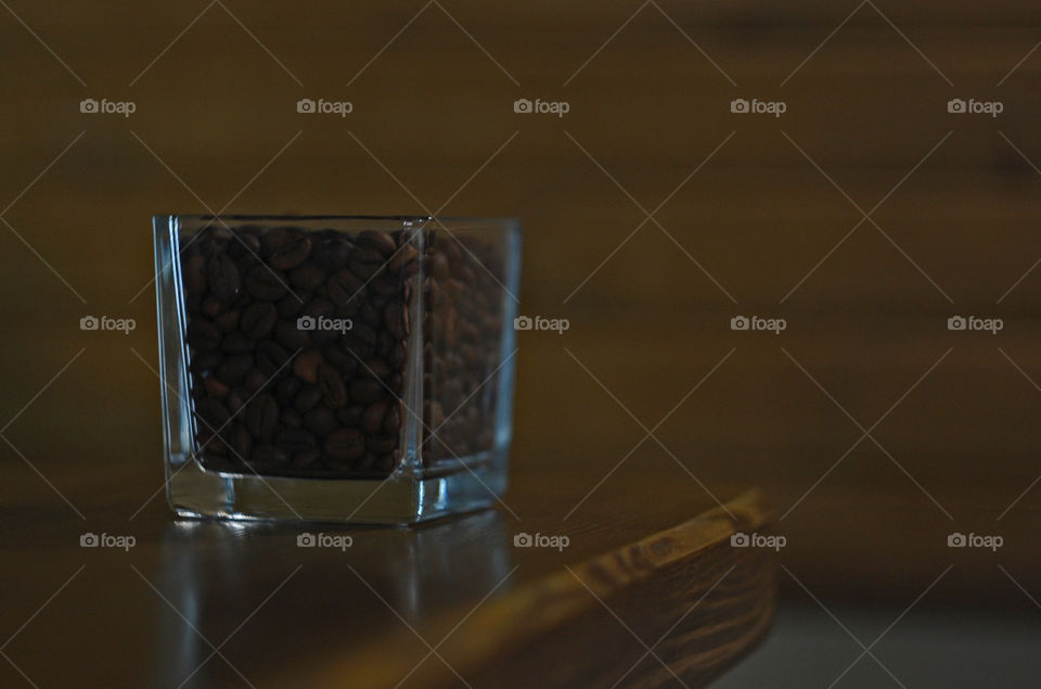 coffee in a glass on a wooden counter in a cafe