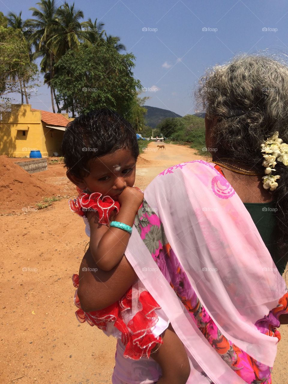 Indian lady holding baby 