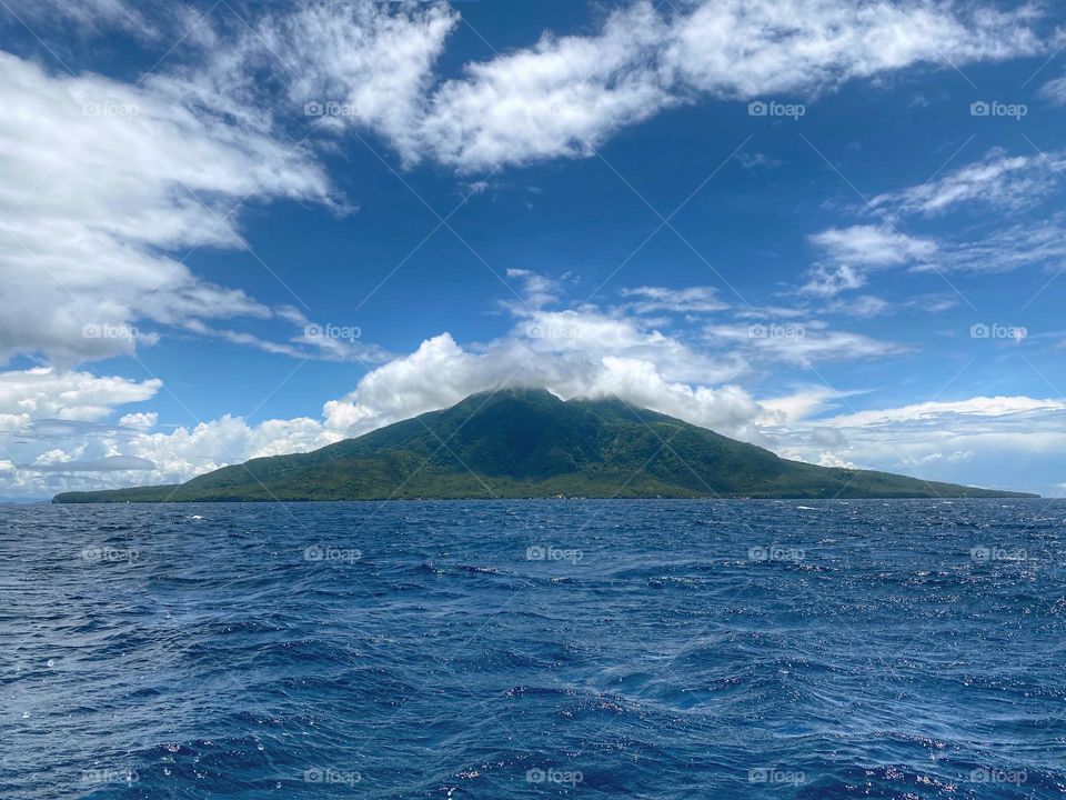 Sky, ocean and mountain a view from Sambawan Island Maripipi Biliran Philippines.