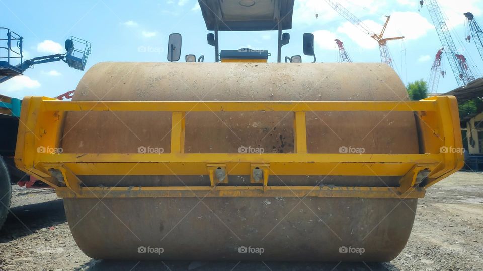 Vibratory roller is a soil compactor equipped with vibration heavy machinery for road and construction area.