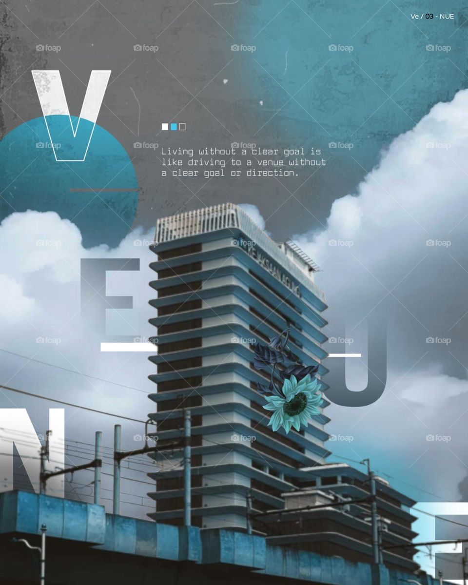 Tall building with clouds and blue sky background, decorated with text and graphic elements