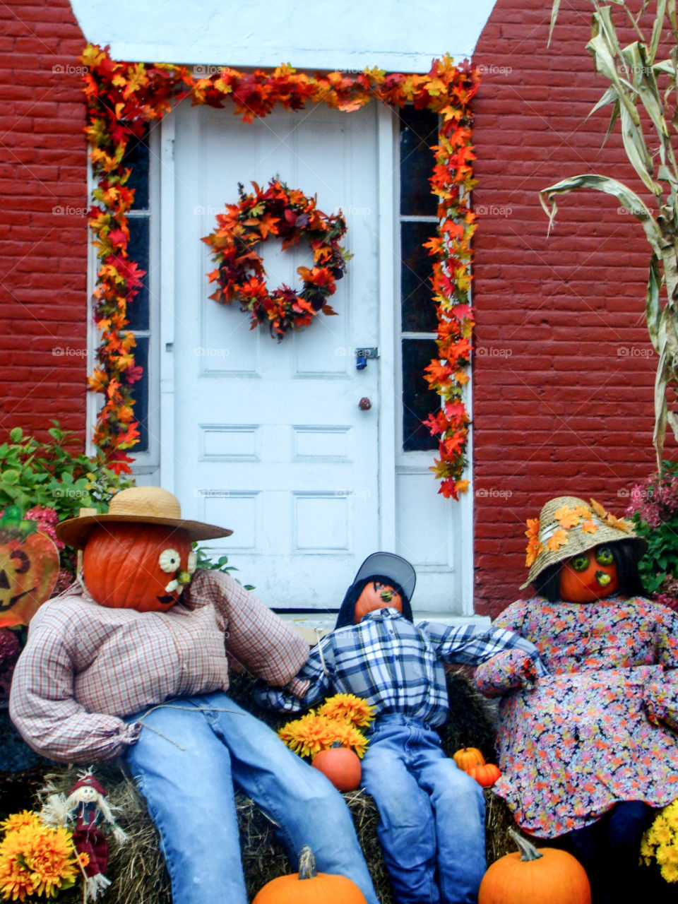A joyful Fall display complete with colorful leaf garlands and Pumpkin People add to the Autumn festivities in the quaint village of Stowe, Vermont.