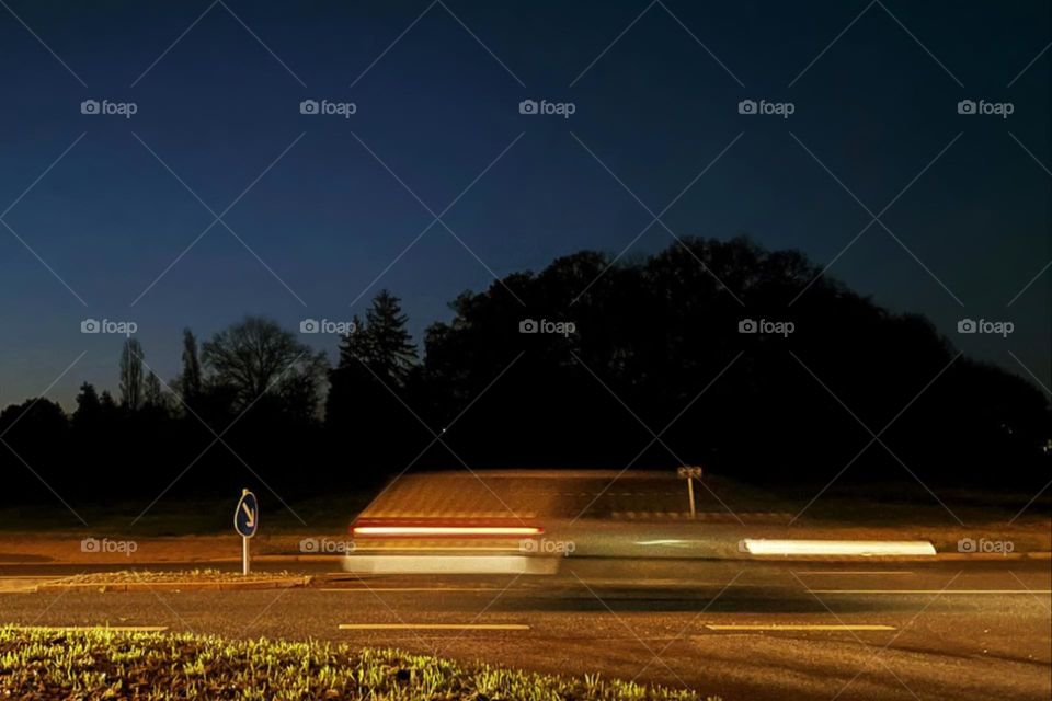 Long exposure of a moving car in the evening