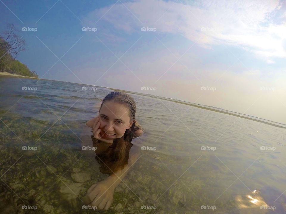 Woman smiling in ocean 