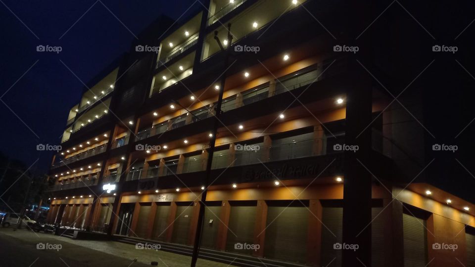 City nights are the best nights!β¨ This building lit up with lights is a sight to behold.π Who else loves the city skyline at night?