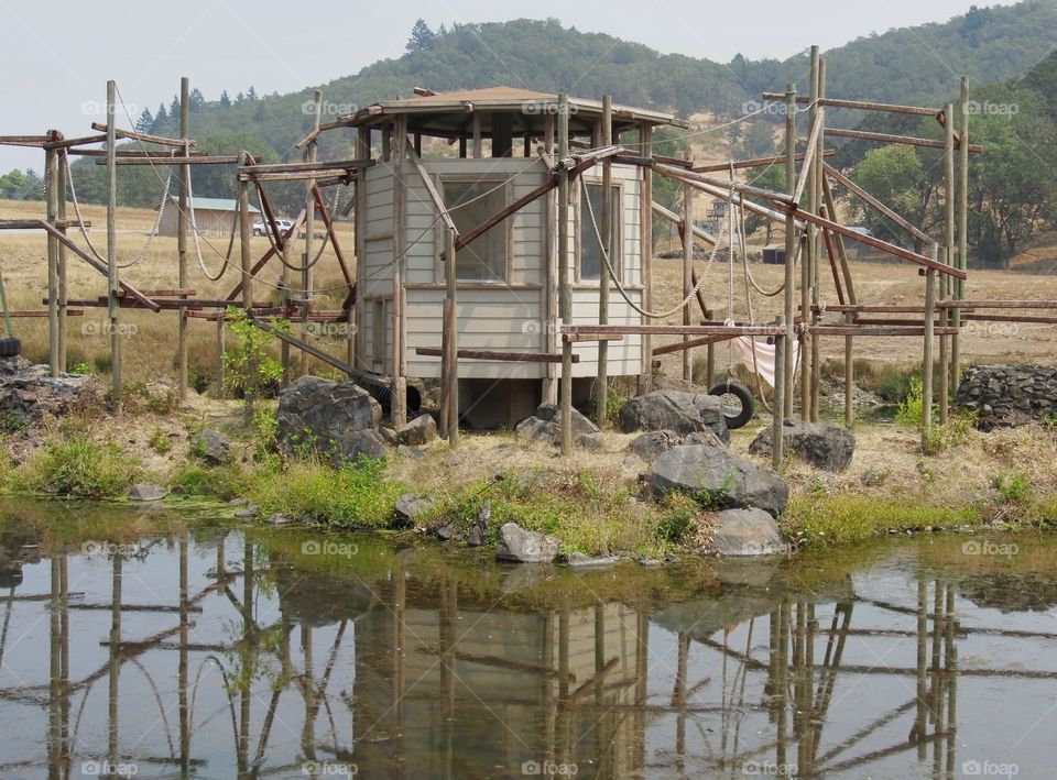 An unused monkey playhouse and structure reflecting in a field at the Wildlife Safari in Winston in Southern Oregon. 
