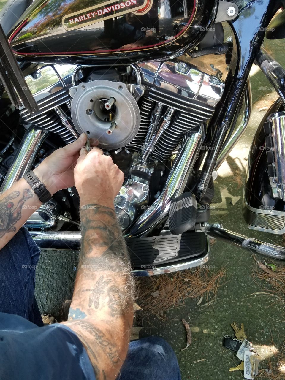 Repairing has leak on Harley Davidson motor.