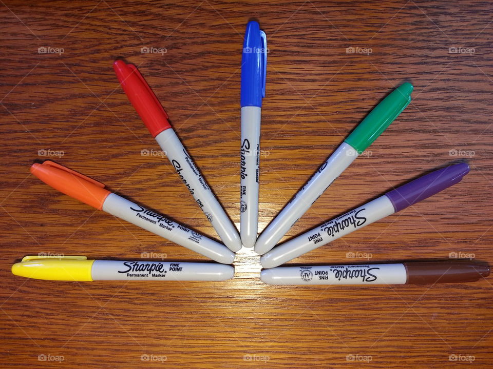 Sharpie markers on desk
