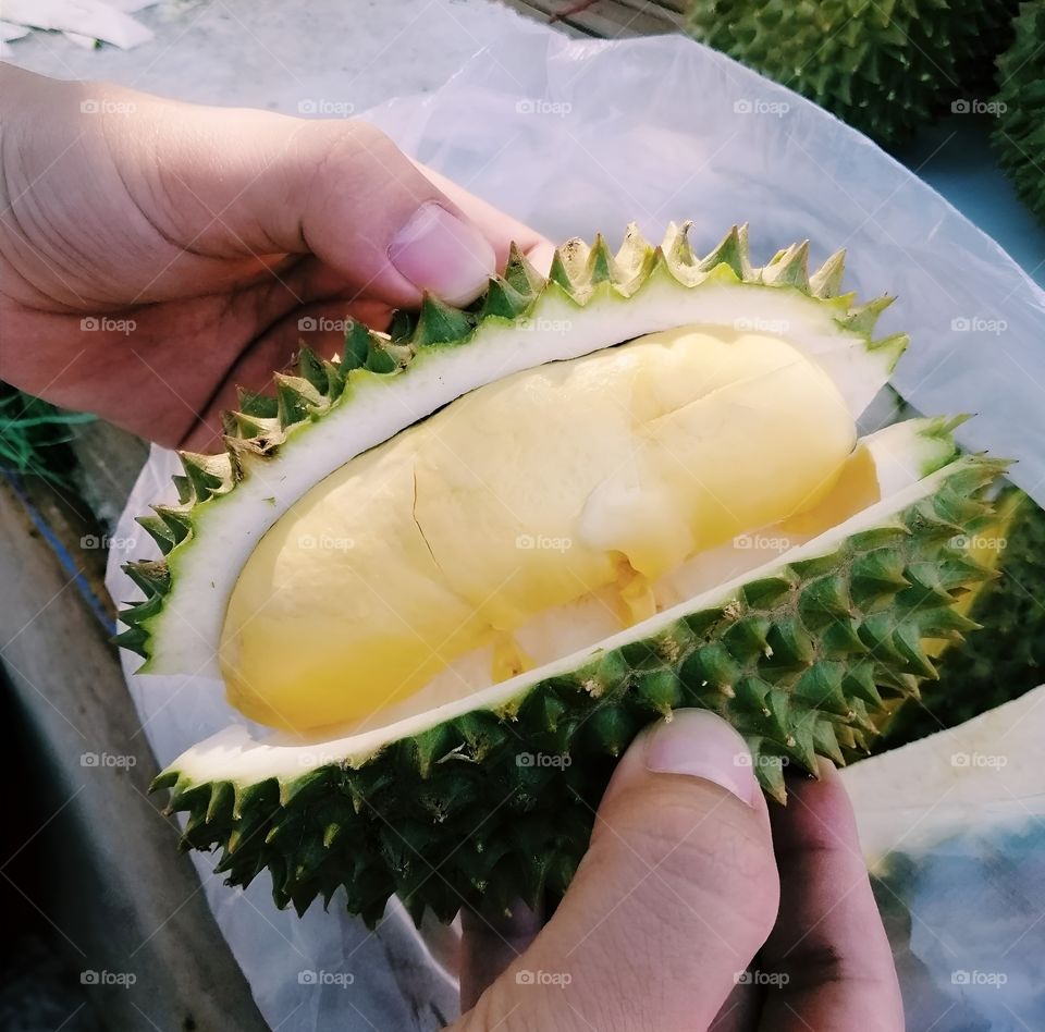 Peel durian in hand. Delicious. King of fruit.