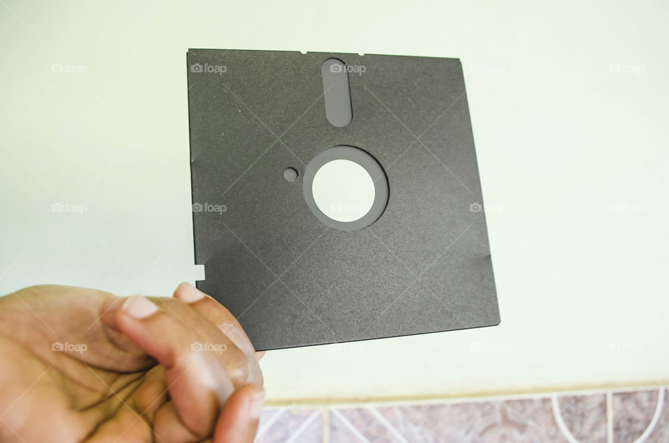 Holding A Floppy Disc
