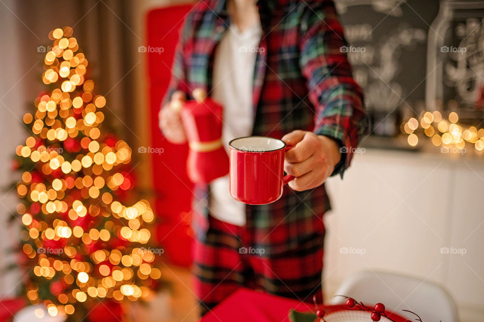 cup of coffee in a cozy festive Christmas atmosphere