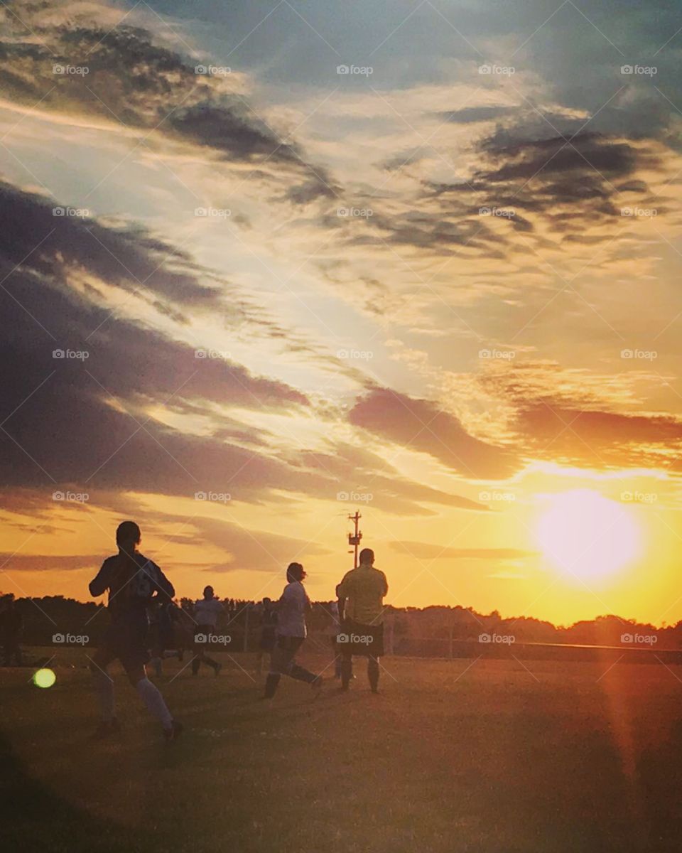 Girls soccer at sunset